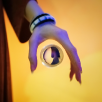 A leak out of the lower bar lady, hand with a photo projection bracelet, she is wearing a silk dress, elegant and generous, focus on highlighting our bracelet in the middle of an orb, this orb can be projected a customer customized photo!